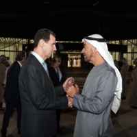 Syrian President Bashar Assad (left) is greeted by the UAE\'s de facto ruler, Sheikh Mohammed bin Zayed Al Nahyan, in the capital, Abu Dhabi, on Friday in this image taken from the Syrian presidency\'s Facebook page. | AFP-JIJI