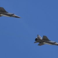 Russian jets carry hypersonic missiles over Red Square in Moscow in May 2018.  | AFP-JIJI