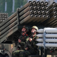 Soldiers ride on a multiple rocket launcher during a military parade marking the 70th anniversary of North Korea\'s foundation in Pyongyang in September 2018. | REUTERS
