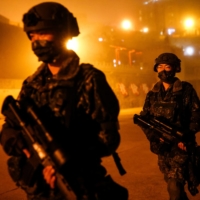 Taiwanese soldiers patrol at night in Dongyin, Taiwan, on Tuesday. | REUTERS