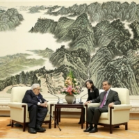 Former U.S. Secretary of State Henry Kissinger (left) meets with Chinese Foreign Minister Wang Yi at the Great Hall of the People in Beijing in November 2019.  | REUTERS
