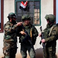 Syrian and Russian soldiers at a checkpoint near Wafideen camp in Damascus, Syria, on March 2, 2018 | REUTERS