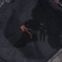 Heavy machinery operates at a coal stockpile site in Taicang, China, on Oct. 23. A plume of methane was detected by a European Space Agency satellite near a remote coal mine in Inner Mongolia on March 1.  | BLOOMBERG
