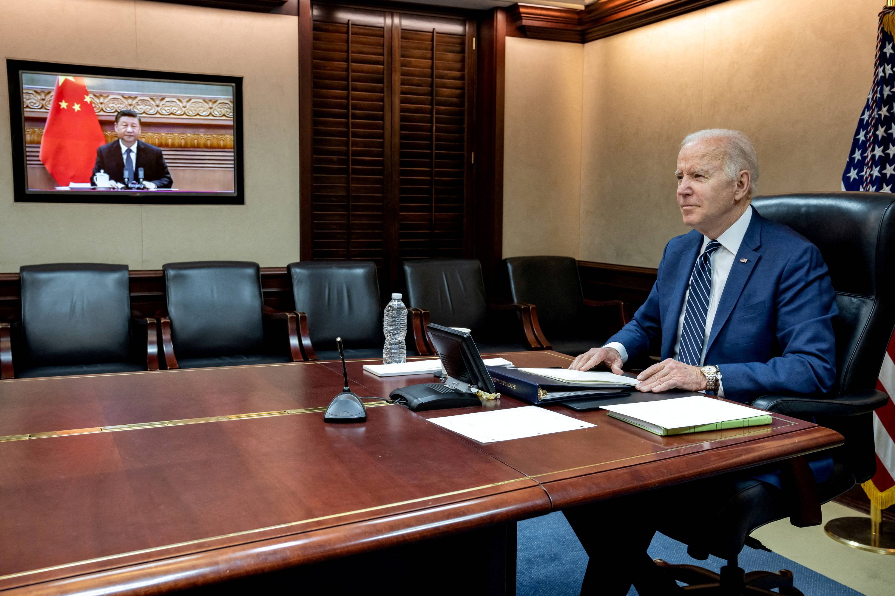 U.S. President Joe Biden holds virtual talks with Chinese leader Xi Jinping from the Situation Room of the White House in Washington on Saturday. | The White House / via REUTERS