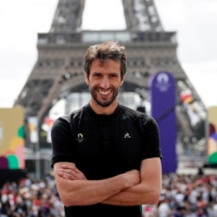 Paris 2024 Olympics Organising Committee President Tony Estanguet poses in front of the Eiffel Tower during a viewing event for the closing ceremony of the Tokyo Olympics in Paris on Aug. 8. | REUTERS
