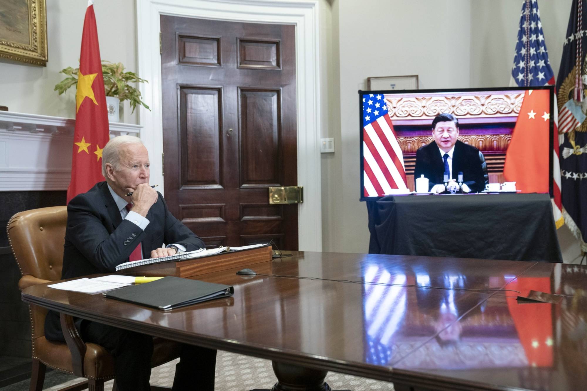U.S. President Joe Biden listens while meeting virtually with Xi Jinping, China's president, in the Roosevelt Room of the White House in Washington, D.C., U.S., on Monday, Nov. 15, 2021. | Bloomberg