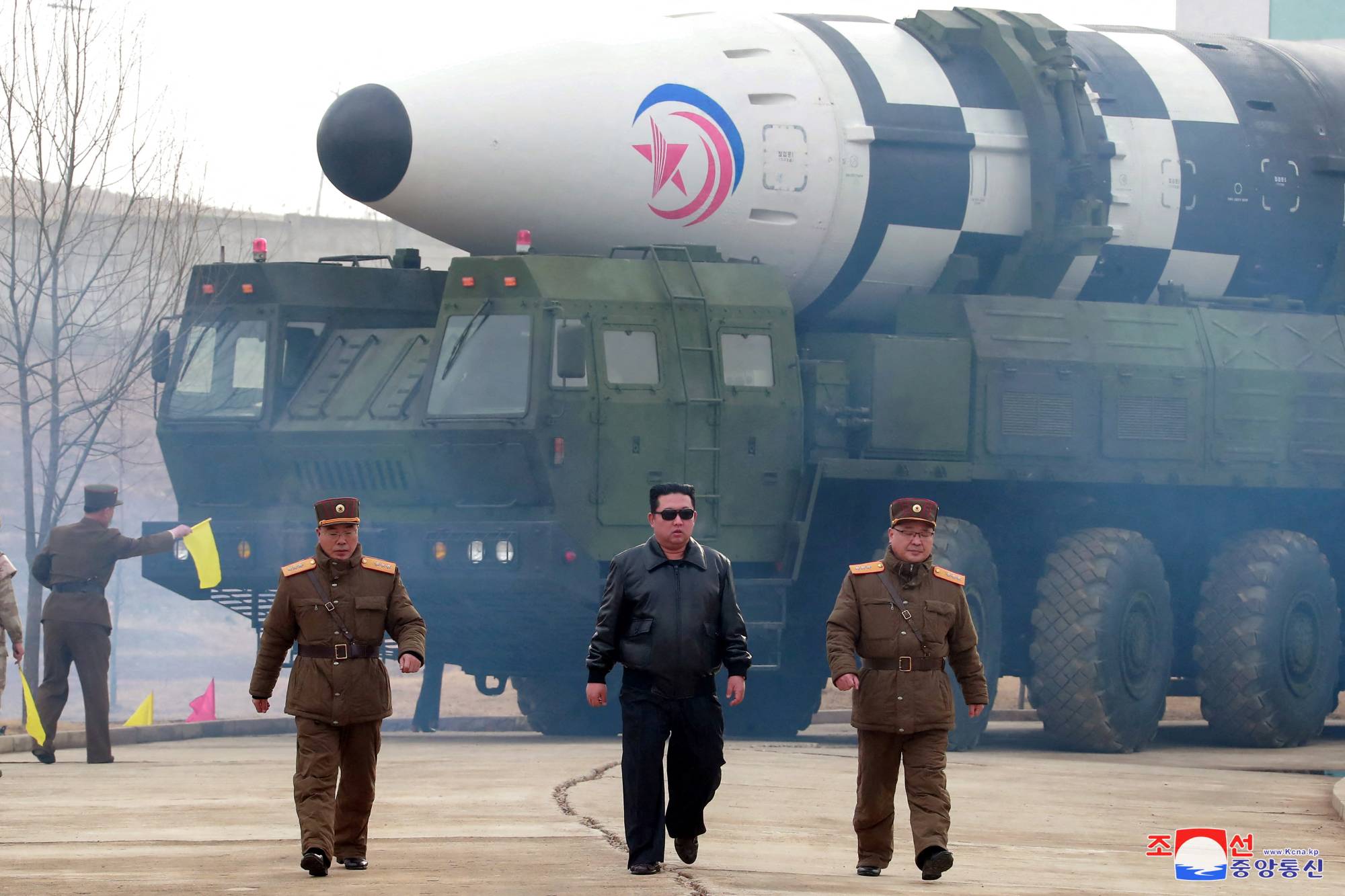 North Korean leader Kim Jong Un walks away from what state media said was a 'new type' of intercontinental ballistic missile in this undated photo released Friday.  | KCNA / VIA REUTERS
