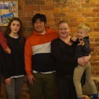 Yugo Azuma (third from right), his fiancee, Marta Kierzek (second from right), and son, together with Ukrainian refugees staying at their house in Katowice in southern Poland | COURTESY OF YUGO AZUMA

