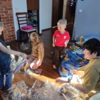 Yugo Azuma (right) plays with his son and the children of a Ukrainian family staying at his home in Katowice in southern Poland. | COURTESY OF YUGO AZUMA
