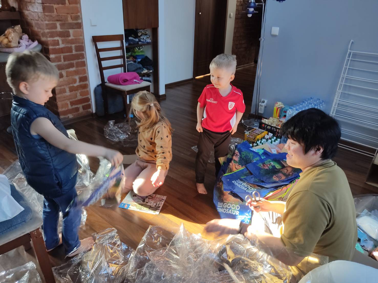Yugo Azuma (right) plays with his son and the children of a Ukrainian family staying at his home in Katowice in southern Poland. | Courtesy of Yugo Azuma 
