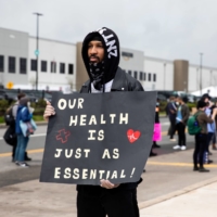Christian Smalls joins warehouse workers and grocery workers on a May Day strike alleging employers, including Amazon, failed to protect their workers during the pandemic, on May 1, 2020. | BLOOMBERG 
