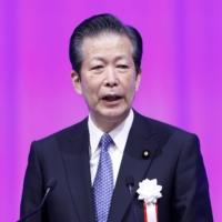 Natsuo Yamaguchi, leader of Komeito, has urged the Bank of Japan to maintain its massive stimulus program \"for a bit longer\" to ensure a solid recovery in the economy. | BLOOMBERG