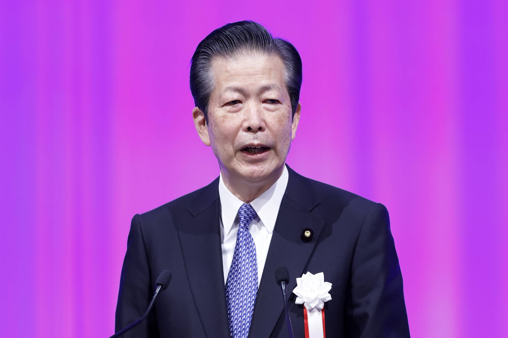 Natsuo Yamaguchi, leader of Komeito, has urged the Bank of Japan to maintain its massive stimulus program 'for a bit longer' to ensure a solid recovery in the economy. | BLOOMBERG