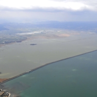 The state-run Isahaya Bay reclamation project. On the right is the Ariake Sea.  | KYODO 