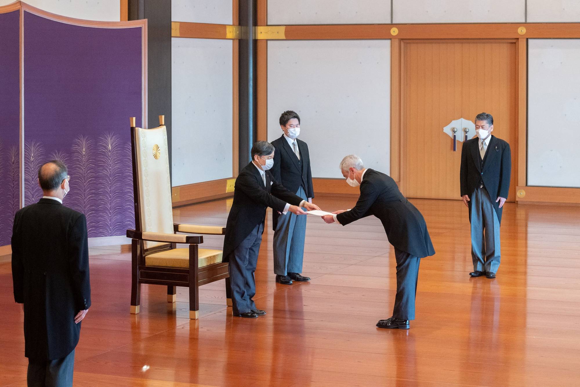 Emperor Naruhito receives credentials from new U.S. Ambassador to Japan Rahm Emanuel during a ceremony at the Imperial Palace in Tokyo on Friday.  | Imperial Household Agency of Japan / via REUTERS