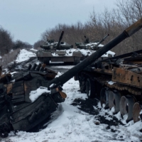 A charred Russian tank and captured tanks are seen, amid Russia\'s invasion of Ukraine, in the country\'s Sumy region on March 7. | PRESS SERVICE OF THE UKRAINIAN GROUND FORCES / VIA REUTERS
