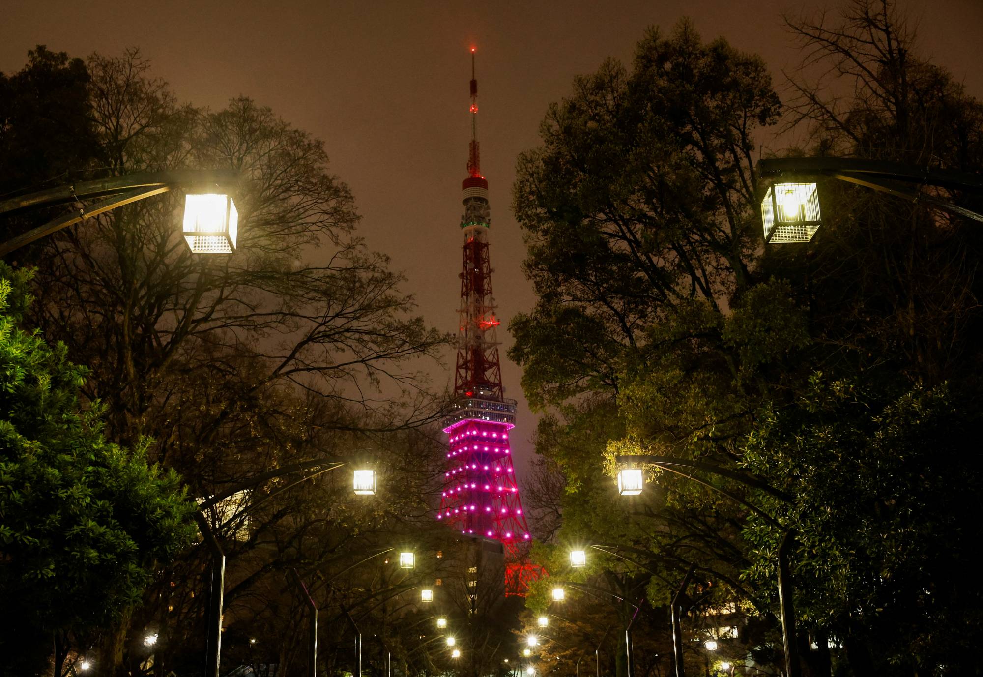 Tokyo Tower's lower-half is illuminated in response to the Japanese government's request to save electricity, in the Japanese capital on Tuesday. | REUTERS