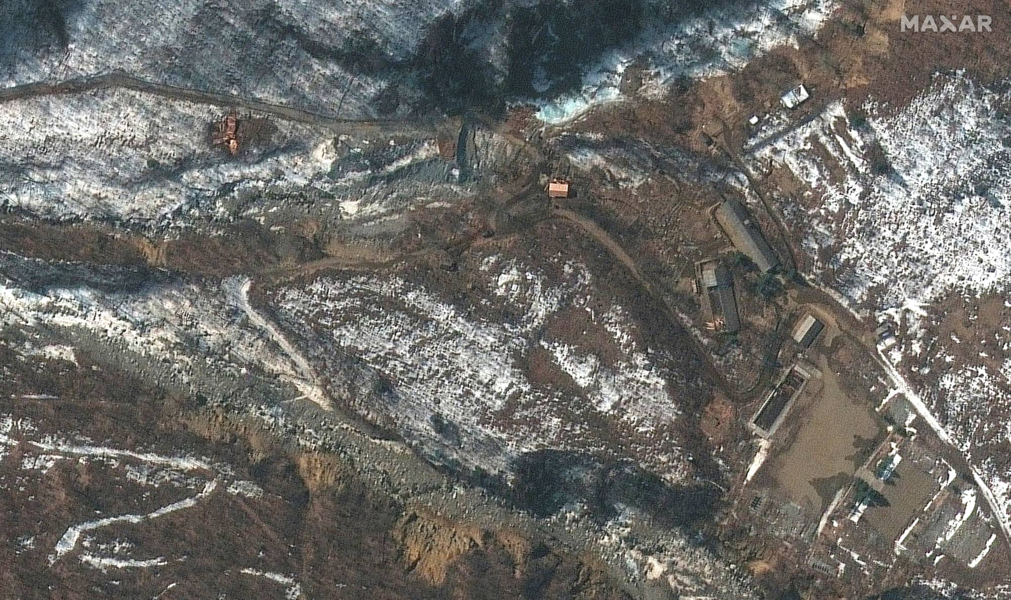 A satellite image shows an overview of new activity at the Punggye-ri nuclear test site in North Korea's North Hamgyong province on March 4. A report says the North could be preparing a 'shortcut' that would allow it to quickly conduct its seventh nuclear test. | ©2022 MAXAR TECHNOLOGIES / VIA REUTERS 