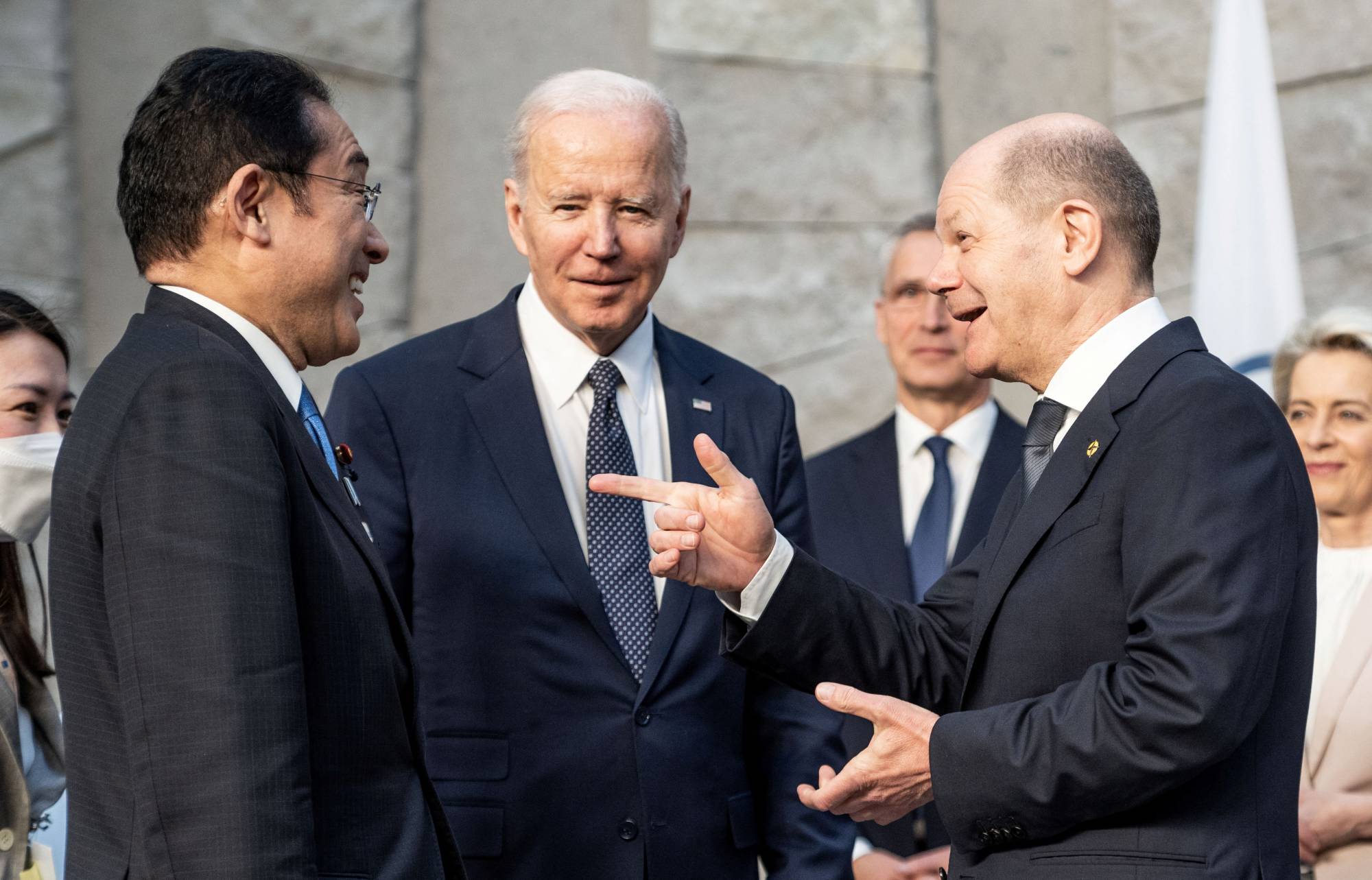 Prime Minister Fumio Kishida, German Chancellor Olaf Scholz and U.S. President Joe Biden meet ahead of a Group of Seven summit in Brussels on Thursday.  | Pool / via REUTERS