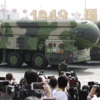 Military vehicles carrying DF-41 intercontinental ballistic missiles travel past Beijing\'s Tiananmen Square during a military parade in October 2019.  | REUTERS