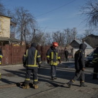 Firefighters at a gas storage facility hit by a Russian shell in Lviv on Sunday | MAURICIO LIMA / THE NEW YORK TIMES
