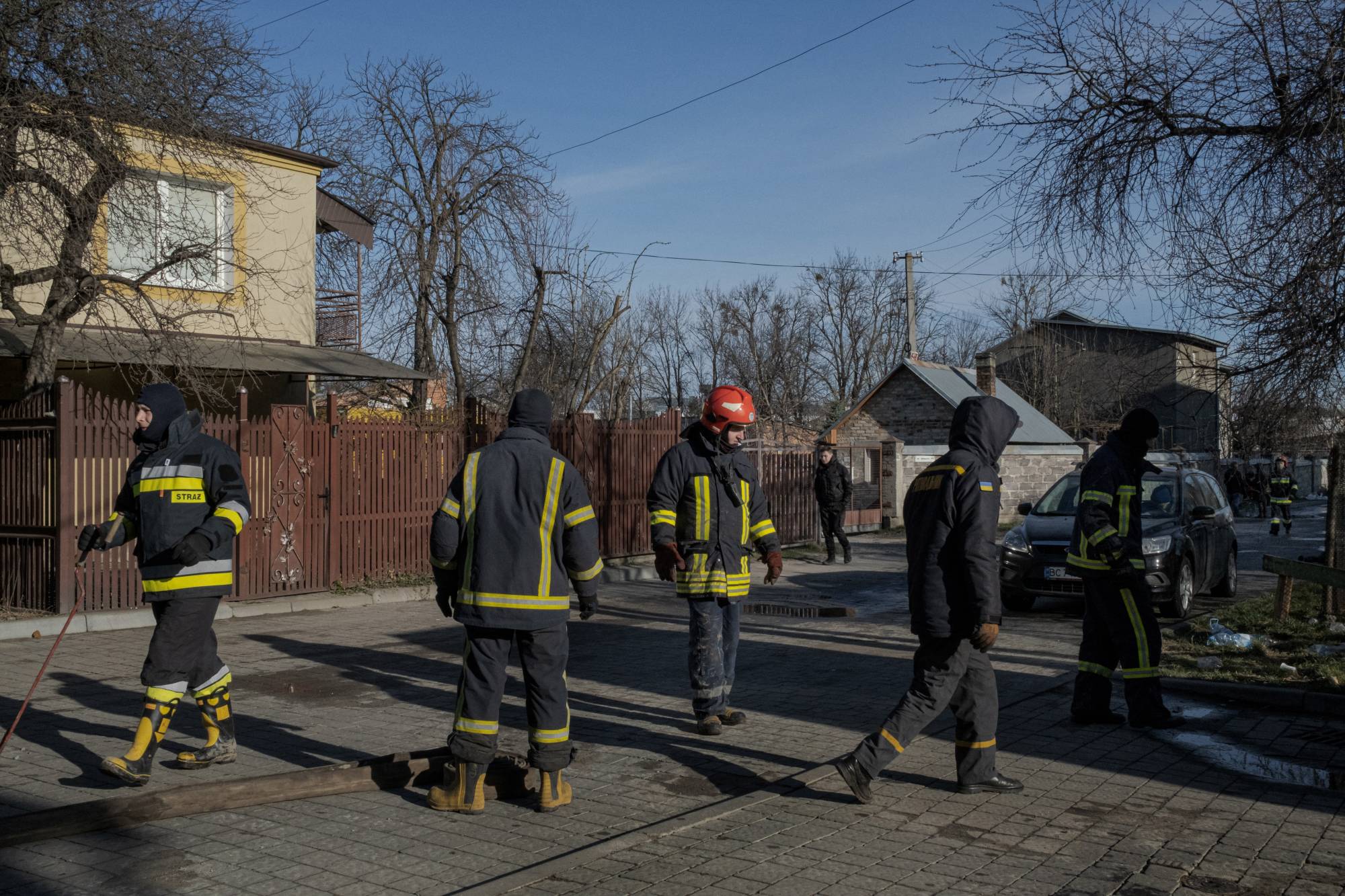 Firefighters at a gas storage facility hit by a Russian shell in Lviv on Sunday | Mauricio Lima / The New York Times