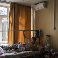 Oleg, 61, recovers in a hospital in Kyiv on Monday after being shot in the leg three times by Russian troops in the nearby suburb of Irpin.  | IVOR PRICKETT / THE NEW YORK TIMES