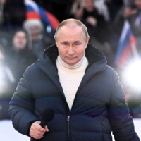 Russian President Vladimir Putin delivers a speech during a concert marking the eighth anniversary of Russia\'s annexation of Crimea at Luzhniki Stadium in Moscow on March 18.  | SPUTNIK / KREMLIN / VIA REUTERS