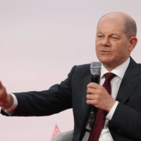 German Channcelor Olaf Scholz speaks at the 2022 Global Solutions summit in Berlin on Monday. | GETTY IMAGES / VIA BLOOMBERG 