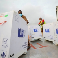 Vaccine doses arrive at Kotoka International Airport in Accra, Ghana, in May 2021. | REUTERS 