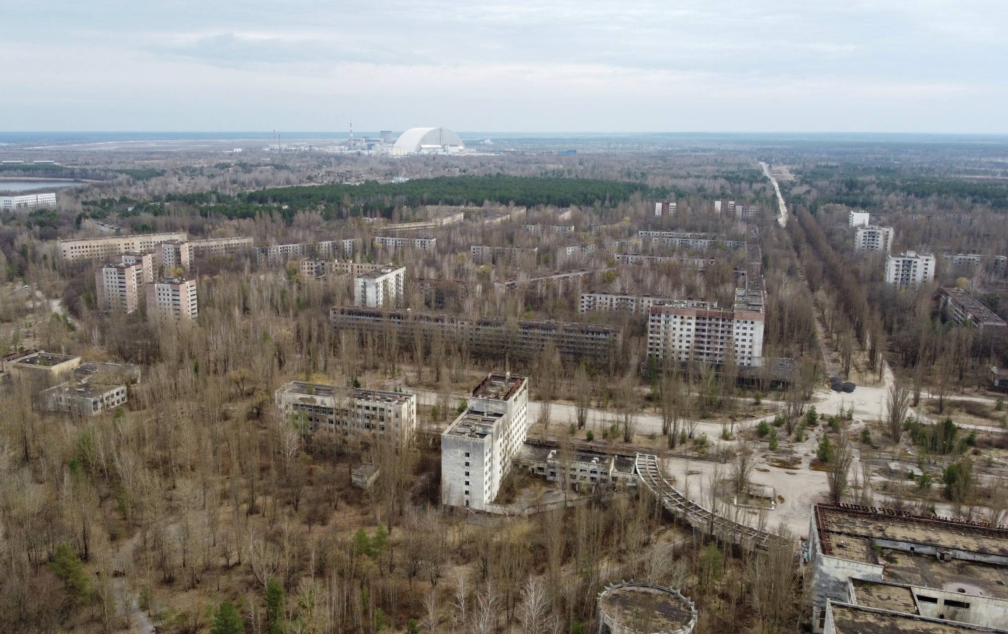 The confinement structure at the Chernobyl plant behind the abandoned town of Pripyat, Ukraine | Reuters 