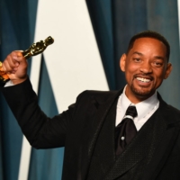 Will Smith displays his award for best actor in a leading role during an Oscar party in Beverly Hills, California, on Sunday. | AFP-JIJI
