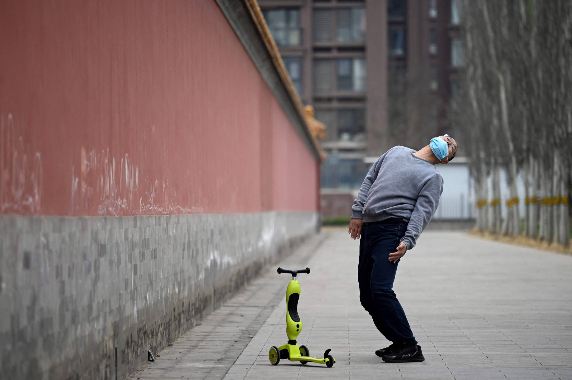A man exercises in Beijing on Tuesday. | AFP-JIJI