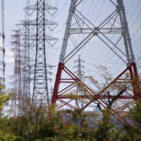 A number of companies in Japan halted power retail operations or temporarily stopped taking on new customers amid a surge in wholesale electricity prices. | BLOOMBERG