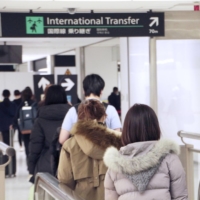 People arrive at Narita Airport from Hanoi on March 1 as Japan eased its cap on the number of daily new entrants from overseas. | KYODO
