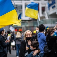 People take part in a fundraising demonstration to support Ukraine in Tokyo\'s Shinjuku district on Saturday. | AFP-JIJI