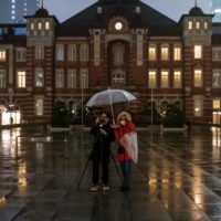 Tokyo Station on Saturday. Businesses in the transportation and farm sectors have been especially impacted by higher prices due to their reliance on gasoline, diesel and fuel oil for engines and grain for livestock feed. | AFP-JIJI