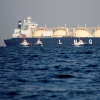 A liquefied natural gas tanker is tugged towards a thermal power station in Futtsu, Chiba Prefecture. | REUTERS
