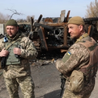 A destroyed Russian armored personal carrier on the front-line near Kyiv on March 28 | AFP-JIJI