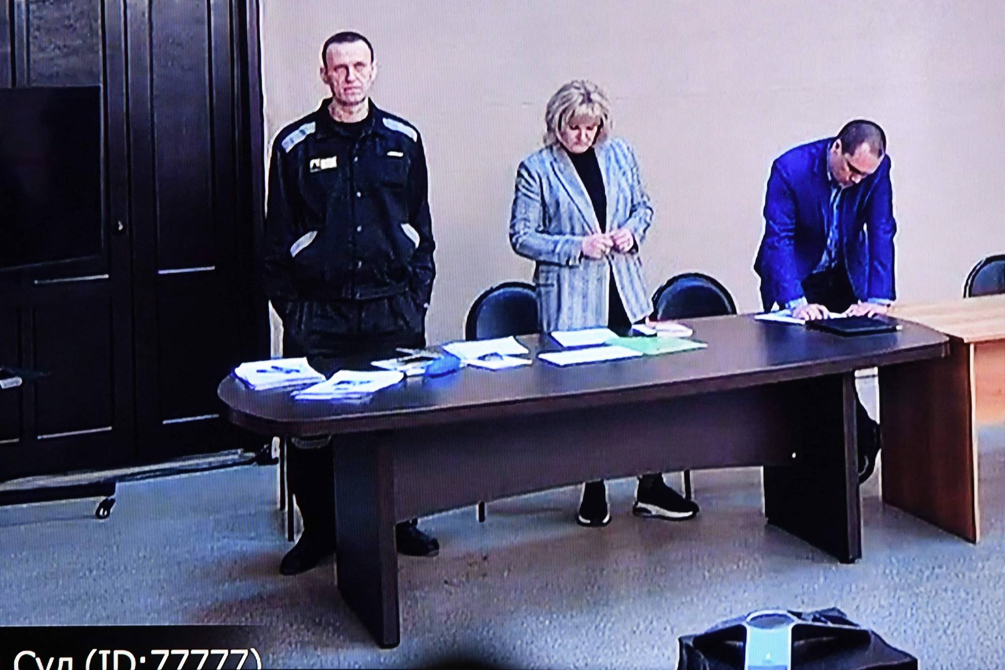 Russian opposition leader Alexei Navalny is seen on a screen via a video link during the verdict in his embezzlement and contempt of court trial at the IK-2 prison colony in Pokrov, Russia, on March 22. | AFP-Jiji