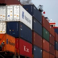 Containers on a ship at the Acajutla port in El Salvador | REUTERS