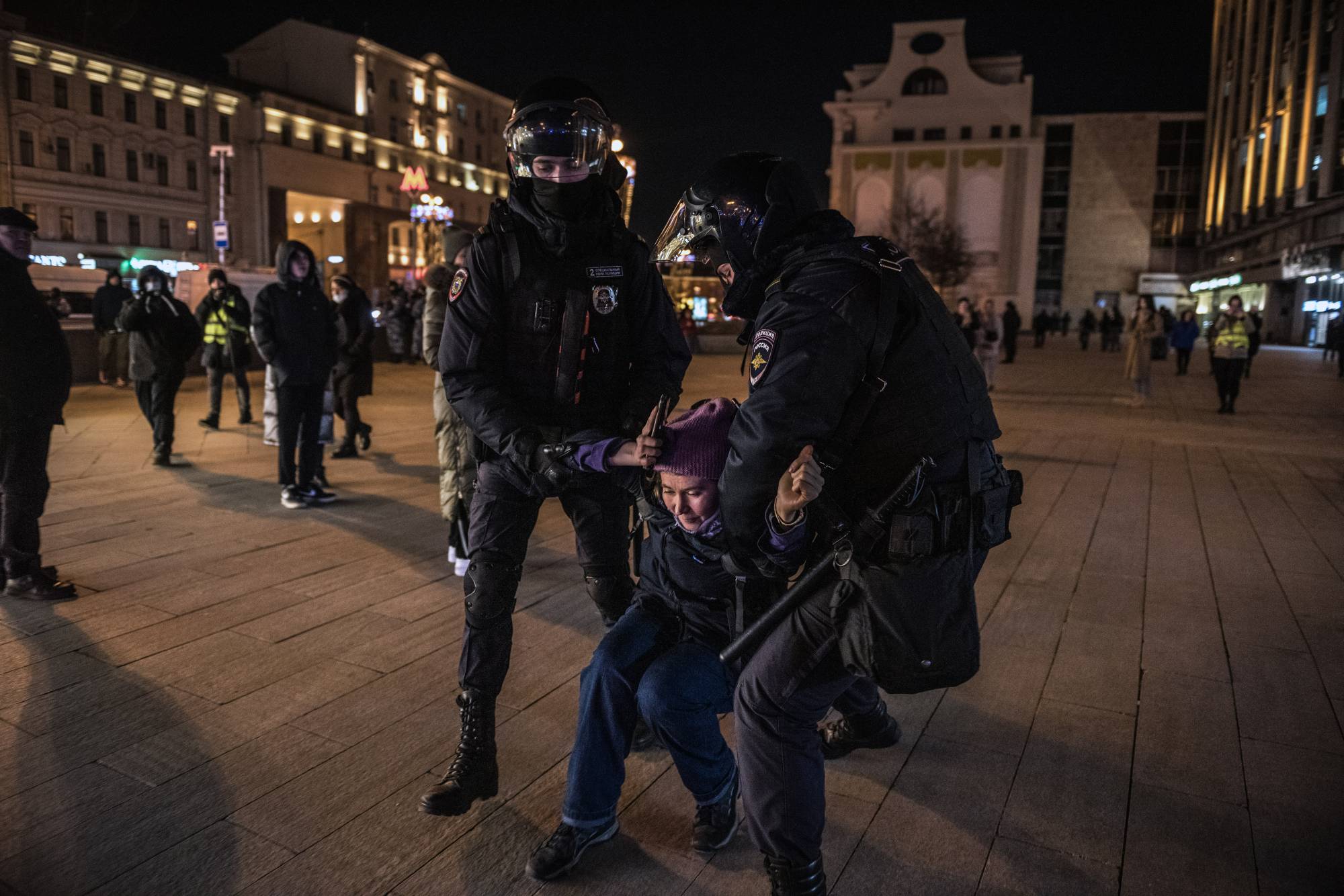 Moscow police detain an anti-war protester on Feb. 25. Protests have largely dried up in recent weeks.  | SERGEY PONOMAREV/THE NEW YORK TIMES