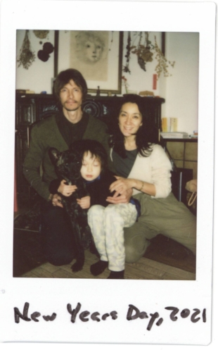 Sean Lotman and Ariko Inoaka pose with their son, Tennbo, and the family dog, Monk. 