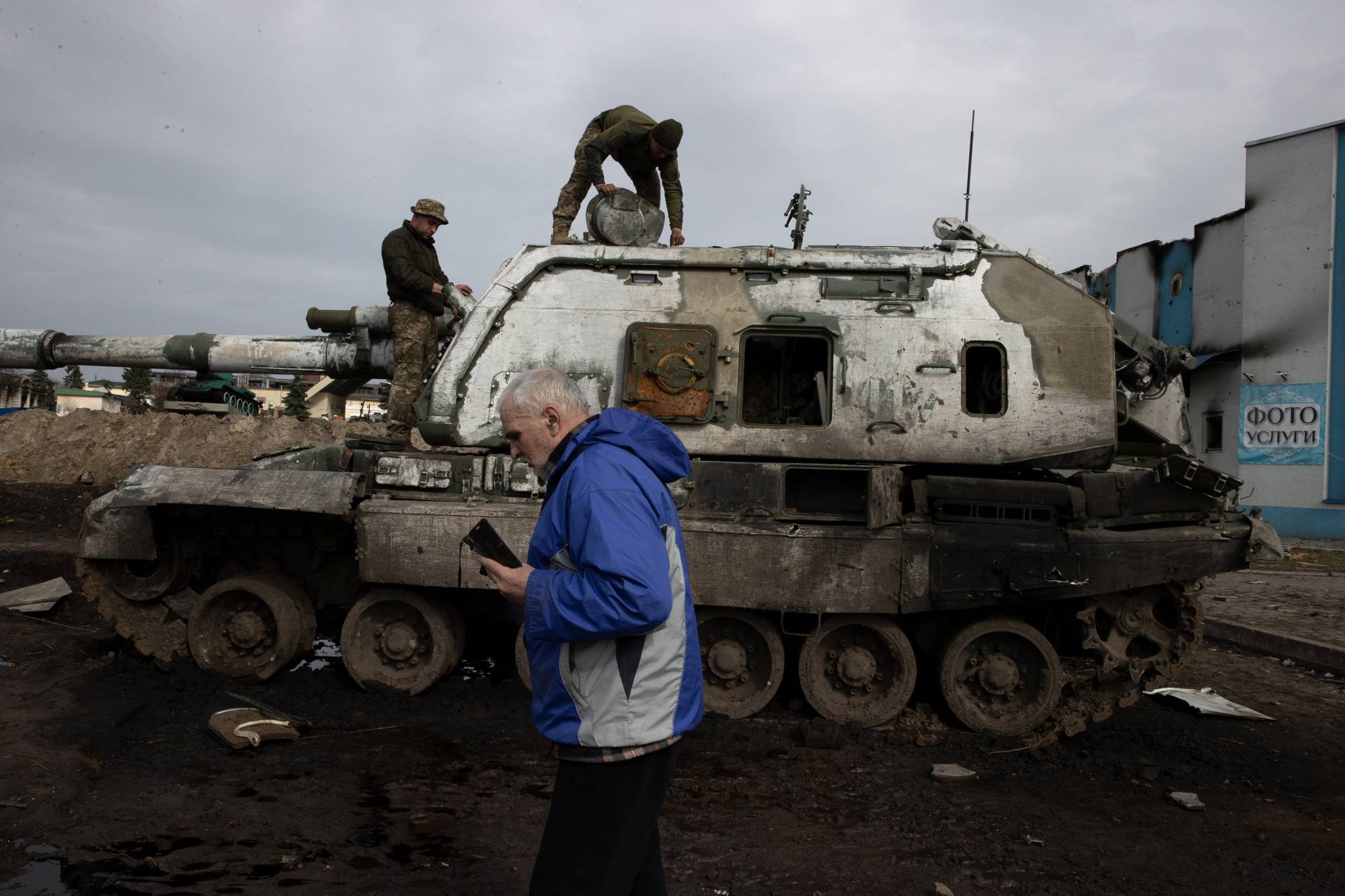 A destroyed Russian armored vehicle in Trostyanets, Ukraine, is seen Friday. Men in the town have cannibalized destroyed Russian armored vehicles for parts or working machinery.  | TYLER HICKS/THE NEW YORK TIMES