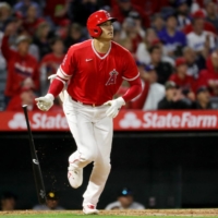 Los Angeles Angels designated hitter Shohei Ohtani hits a homerun against the Los Angeles Dodgers at Angel Stadium in Anaheim on Sunday. | USA TODAY / VIA REUTERS