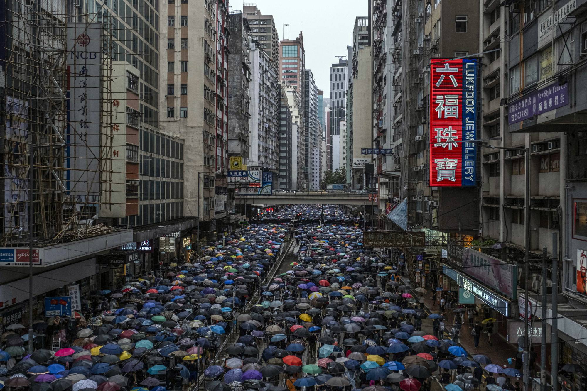 Demonstrators demanding the resignation of Carrie Lam, the chief executive of Hong Kong, pack a street in Hong Kong in 2019.  | Lam Yik Fei / The New York Times