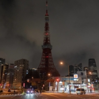 Tokyo Tower is unlit after the Tokyo Metropolitan Government turned off its lights to conserve energy on March 22. | BLOOMBERG