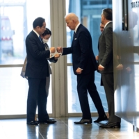 Prime Minister Fumio Kishida and U.S. President Joe Biden meet in Brussels last month. | REUTERS