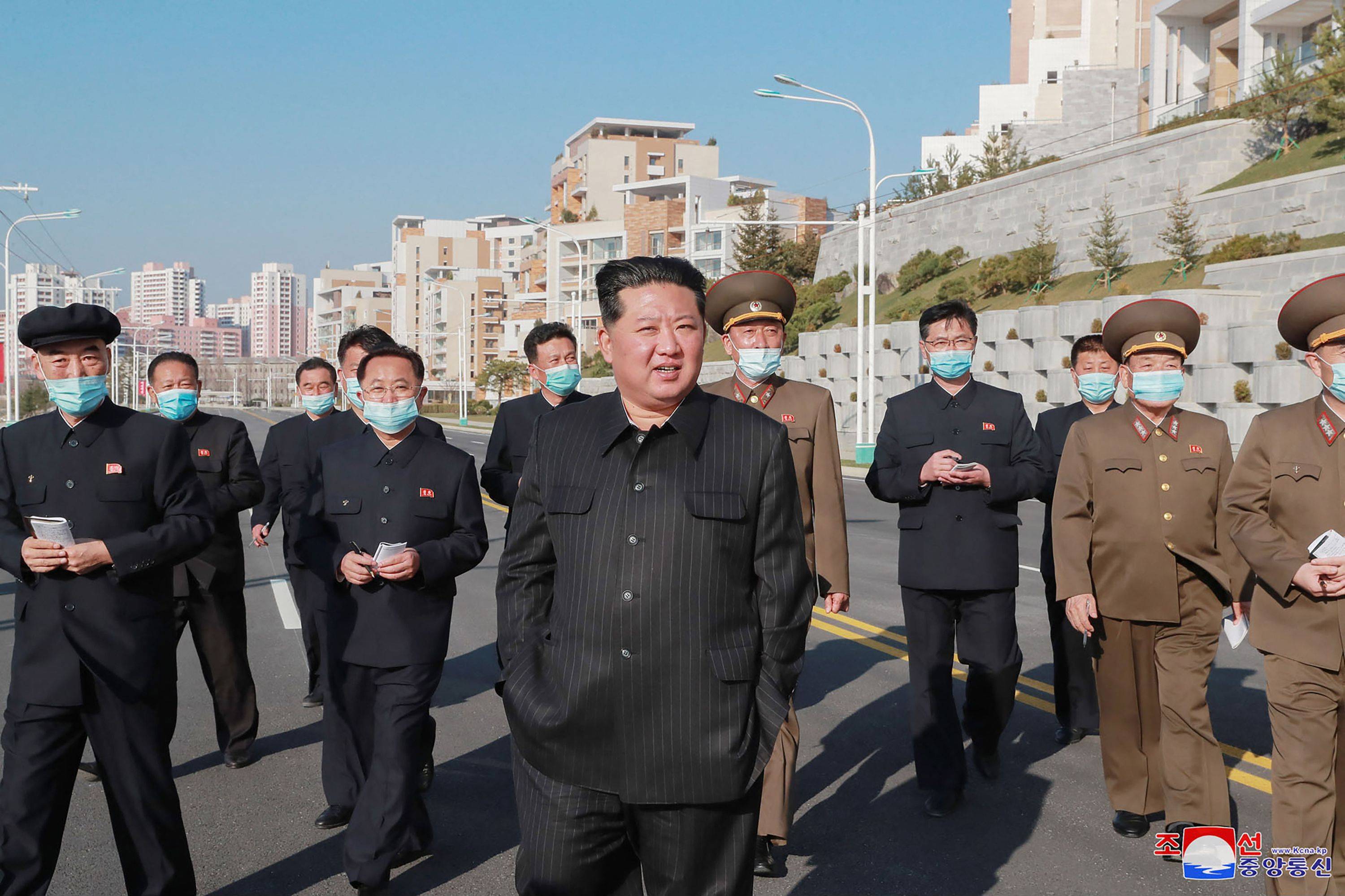 North Korean leader Kim Jong Un inspects the construction of a residential area along a riverbank in Pyongyang.  | KCNA / KNS / VIA AFP-JIJI