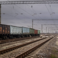 Idle freight train cars on rail tracks that run alongside a deserted road, not pictured, to Crimea in the Henicheskyi region of Kherson Oblast, Ukraine, on Jan. 19. | BLOOMBERG
